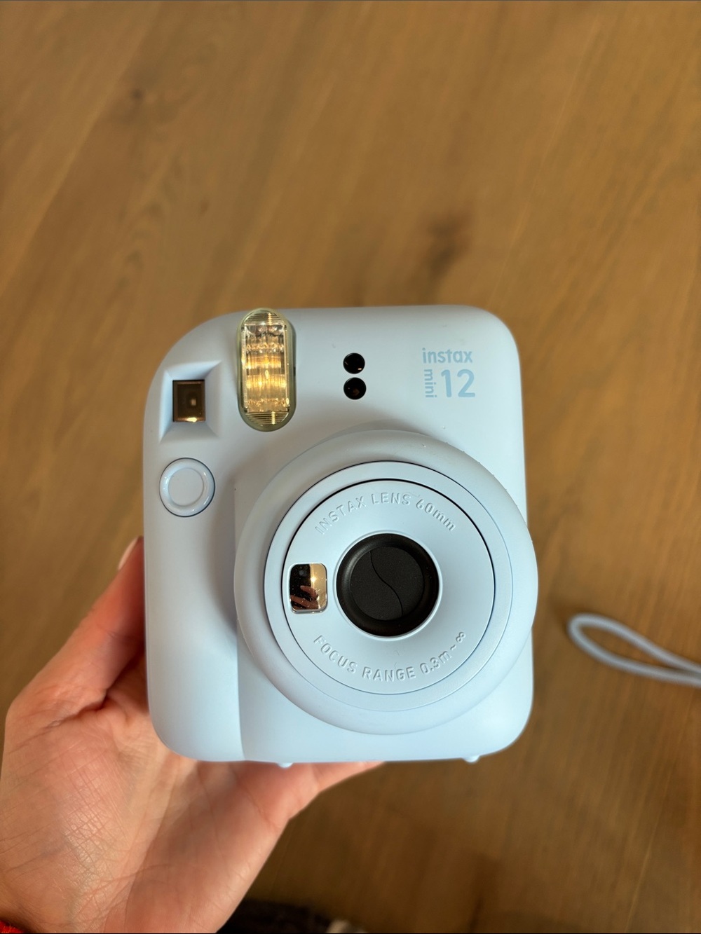 Instax mini 12 instant film camera, case, and film